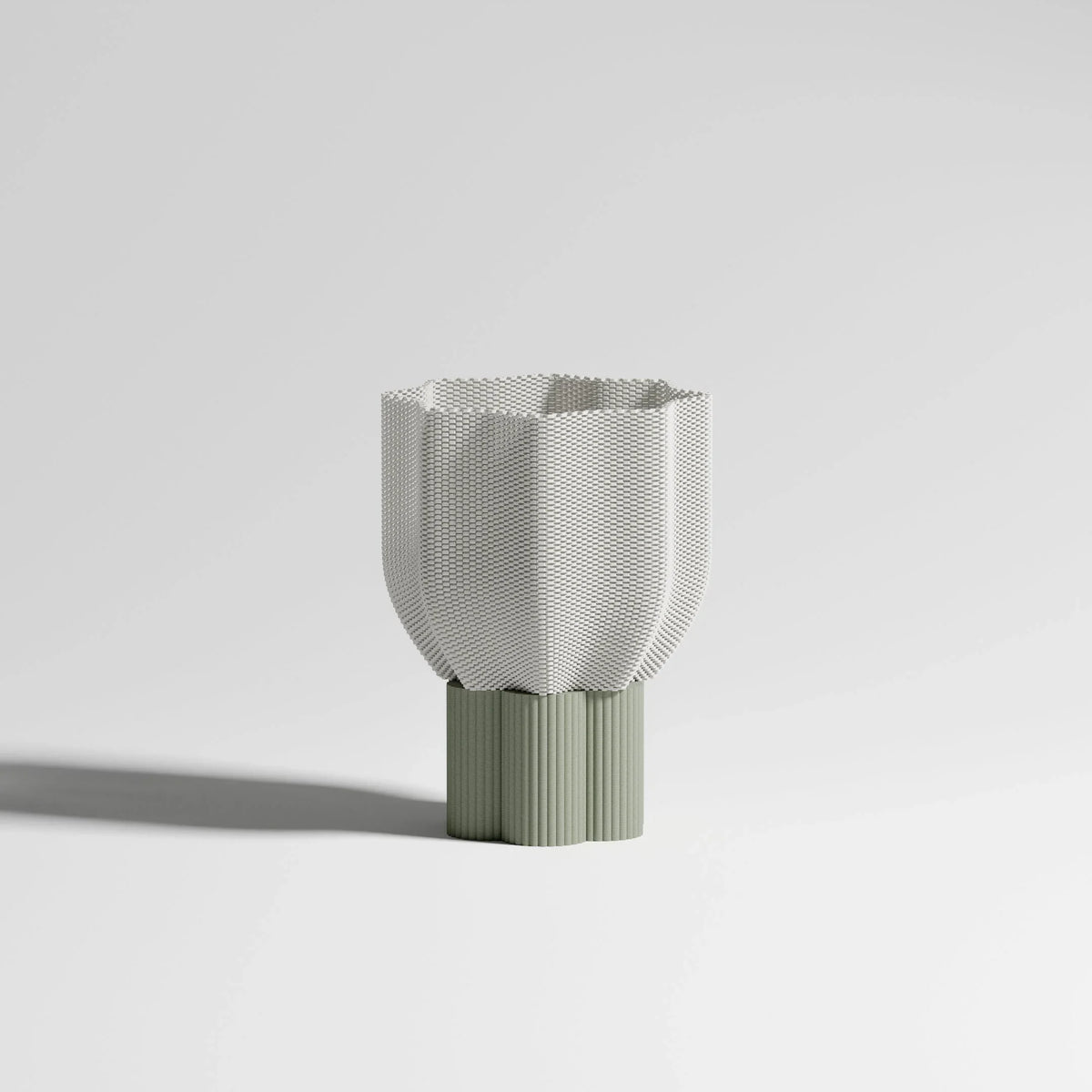 Bloom lamp with olive green base on white background. Floral shade in biobased material. Minimalist and sustainable design.