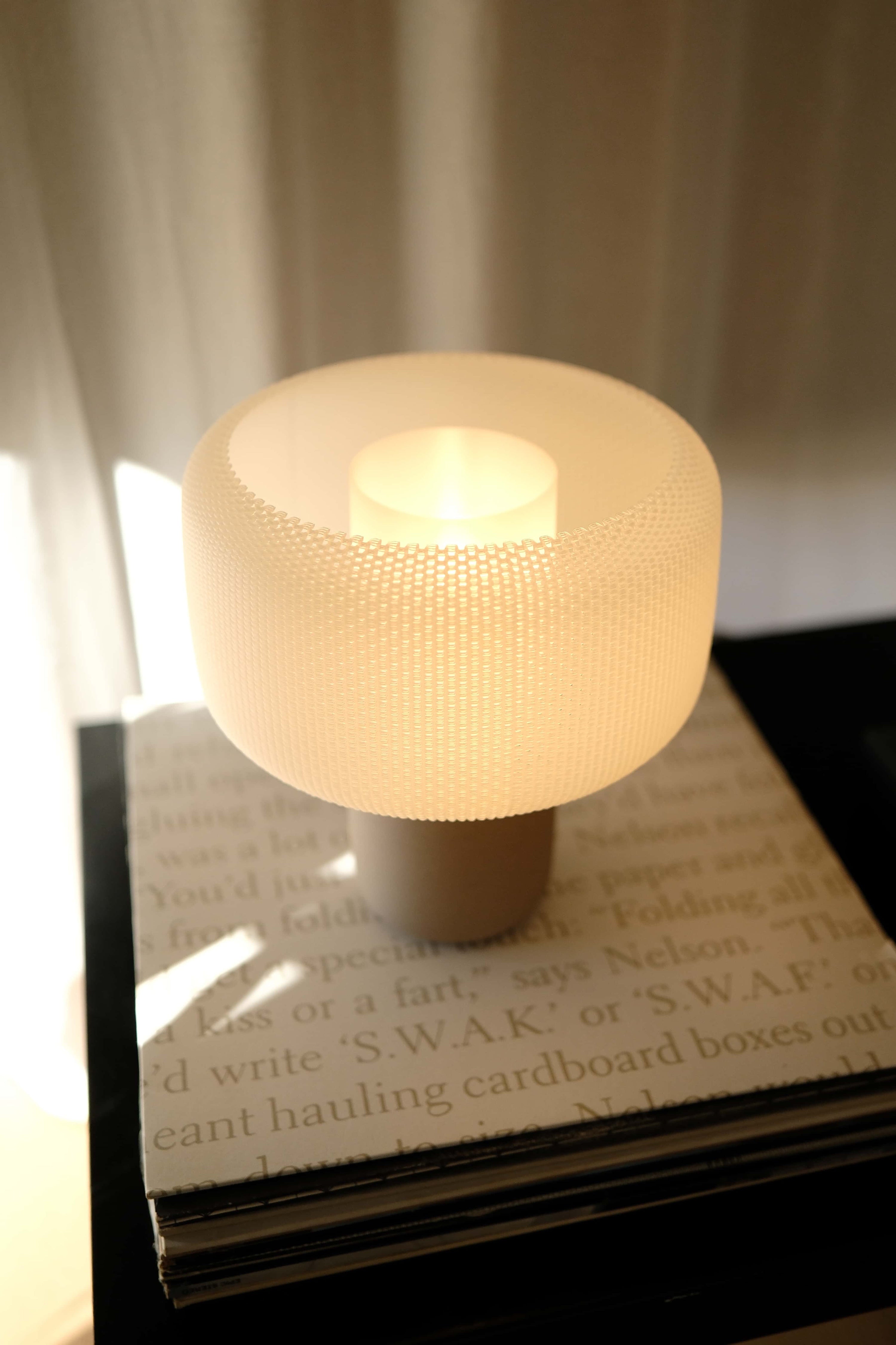 Small lamp on a surface with a blurred background #color_Natural