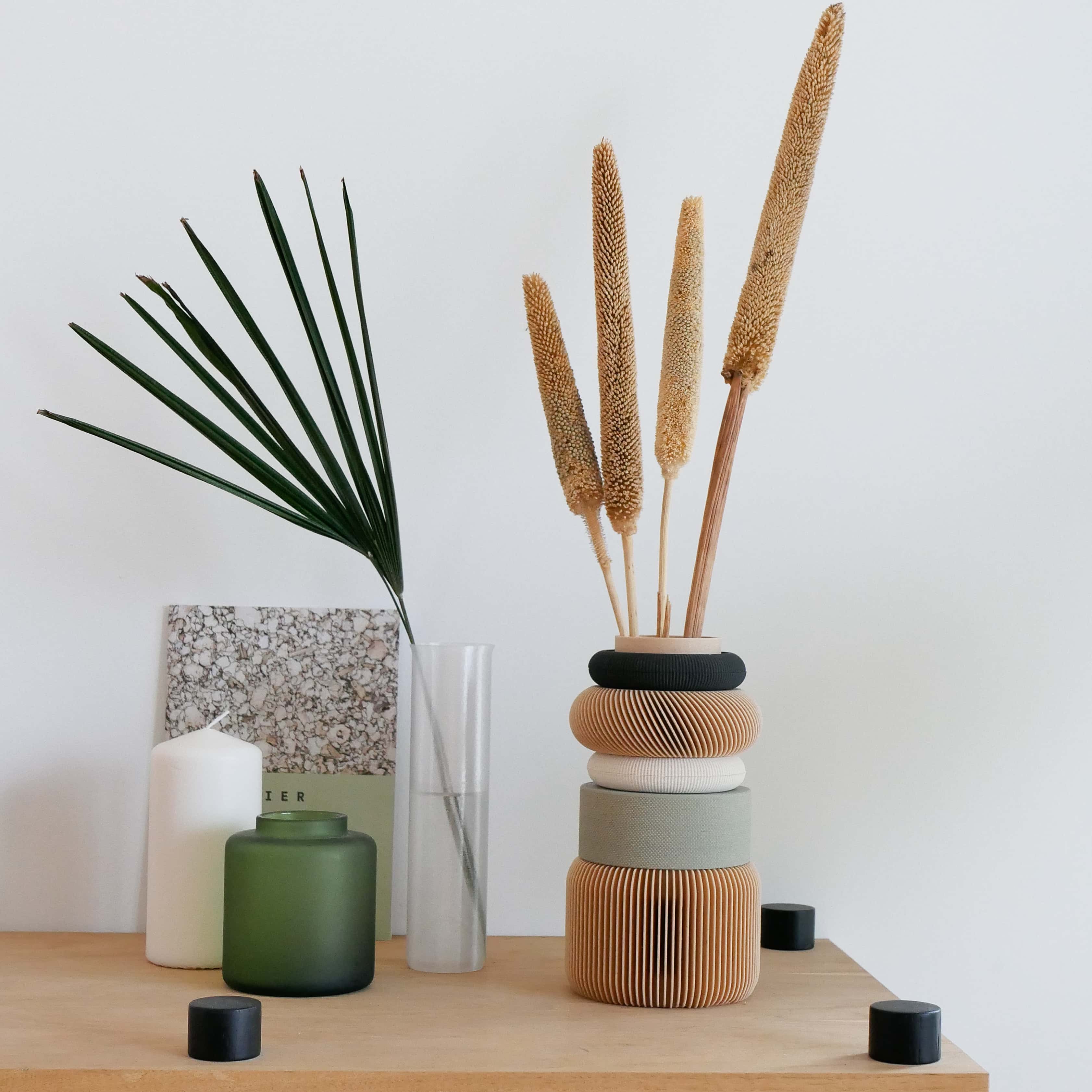 Elegant Olive Vase - Ideal for Dried and Fresh Floral Arrangements
The Nu Vase in olive is displayed with dried florals, emphasizing its adaptability for both fresh and dried arrangements. A perfect addition to eco-friendly and modern interiors