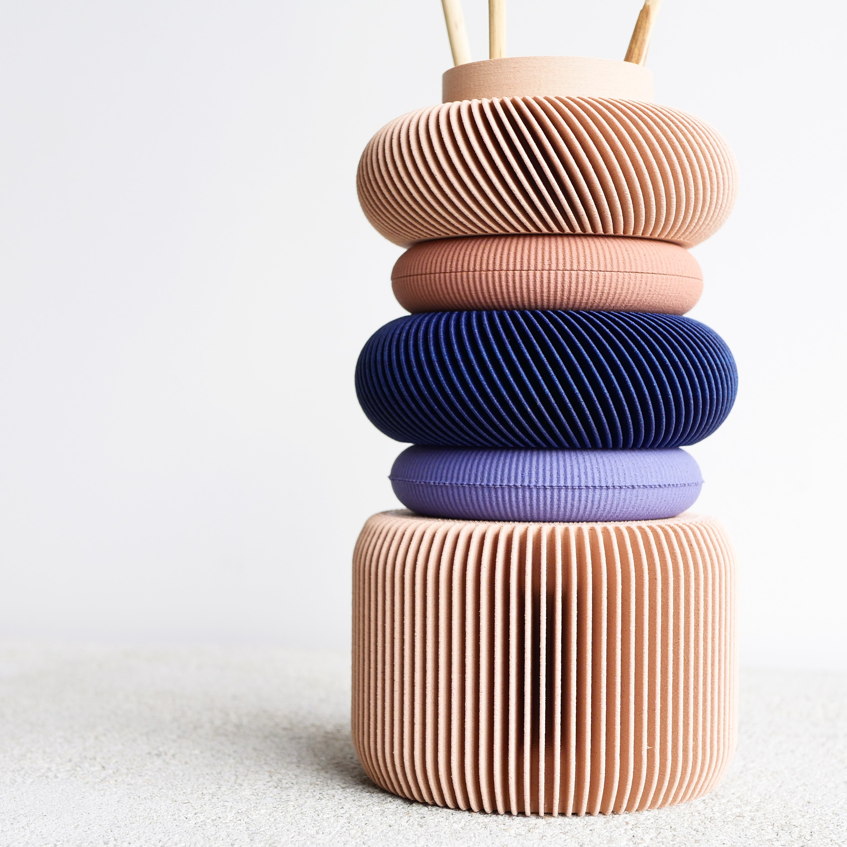 Focus on texture and color of the blush modular Vase