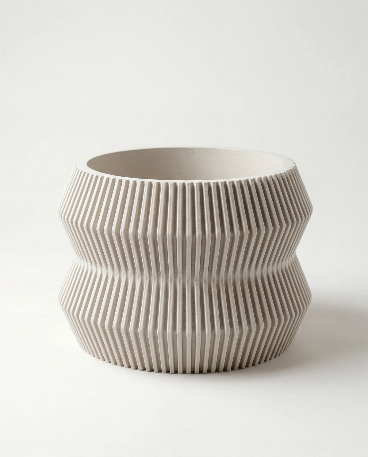 Mist white planter with ribbed texture on a white background