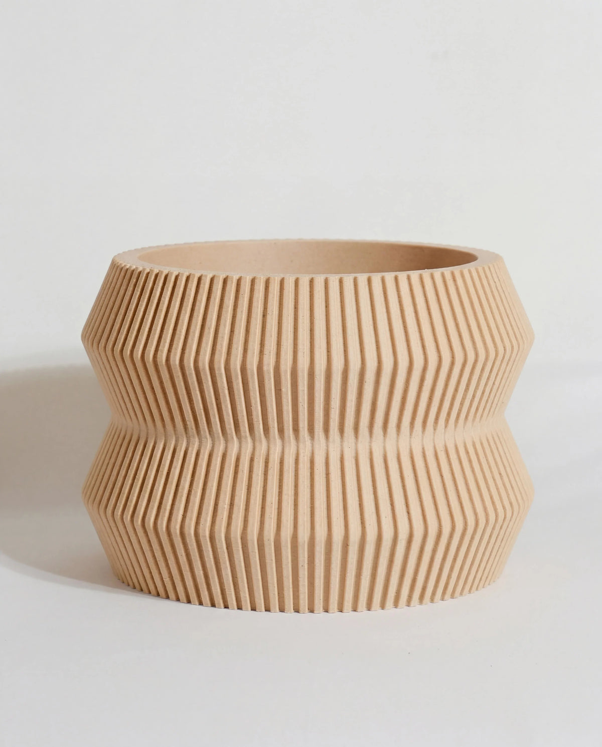 Beige planter 15cm with ribbed texture on a light background