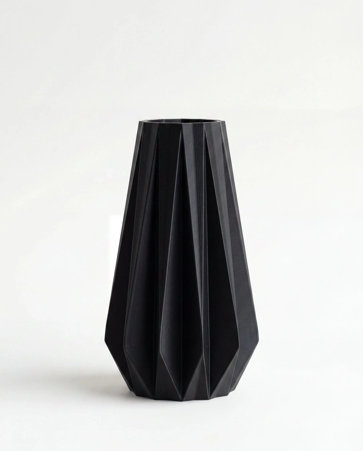 Origami vase black 20cm - geometric pleated design on white background