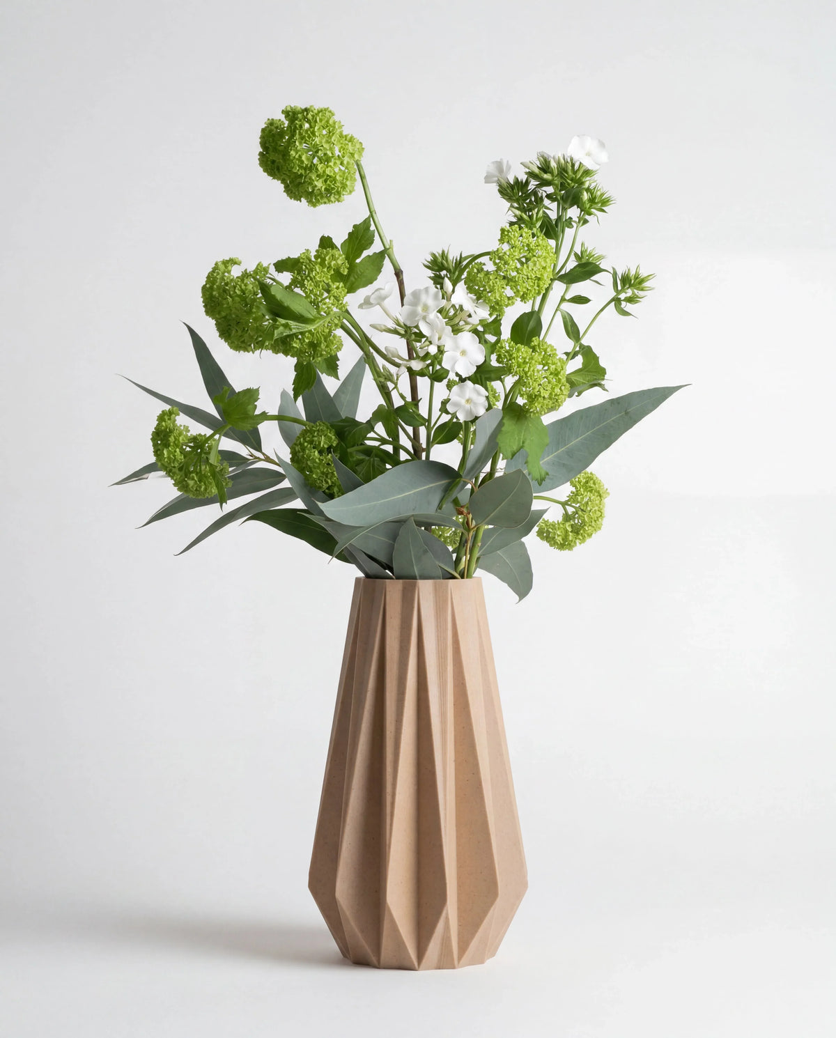 Origami vase natural with fresh flowers - minimalist geometric vase white background