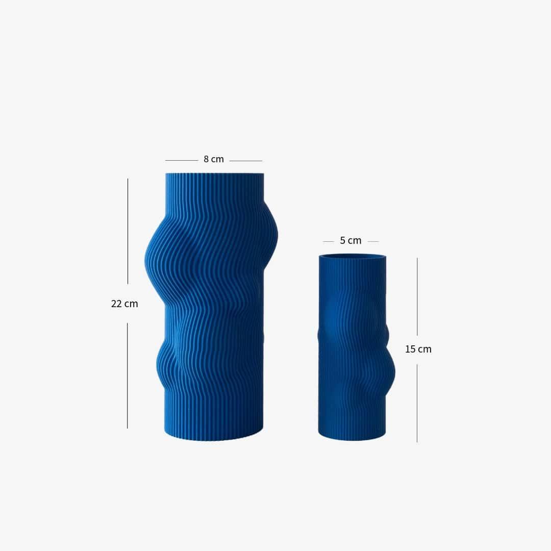 Two blue textured and organical vases with measurements on a white background