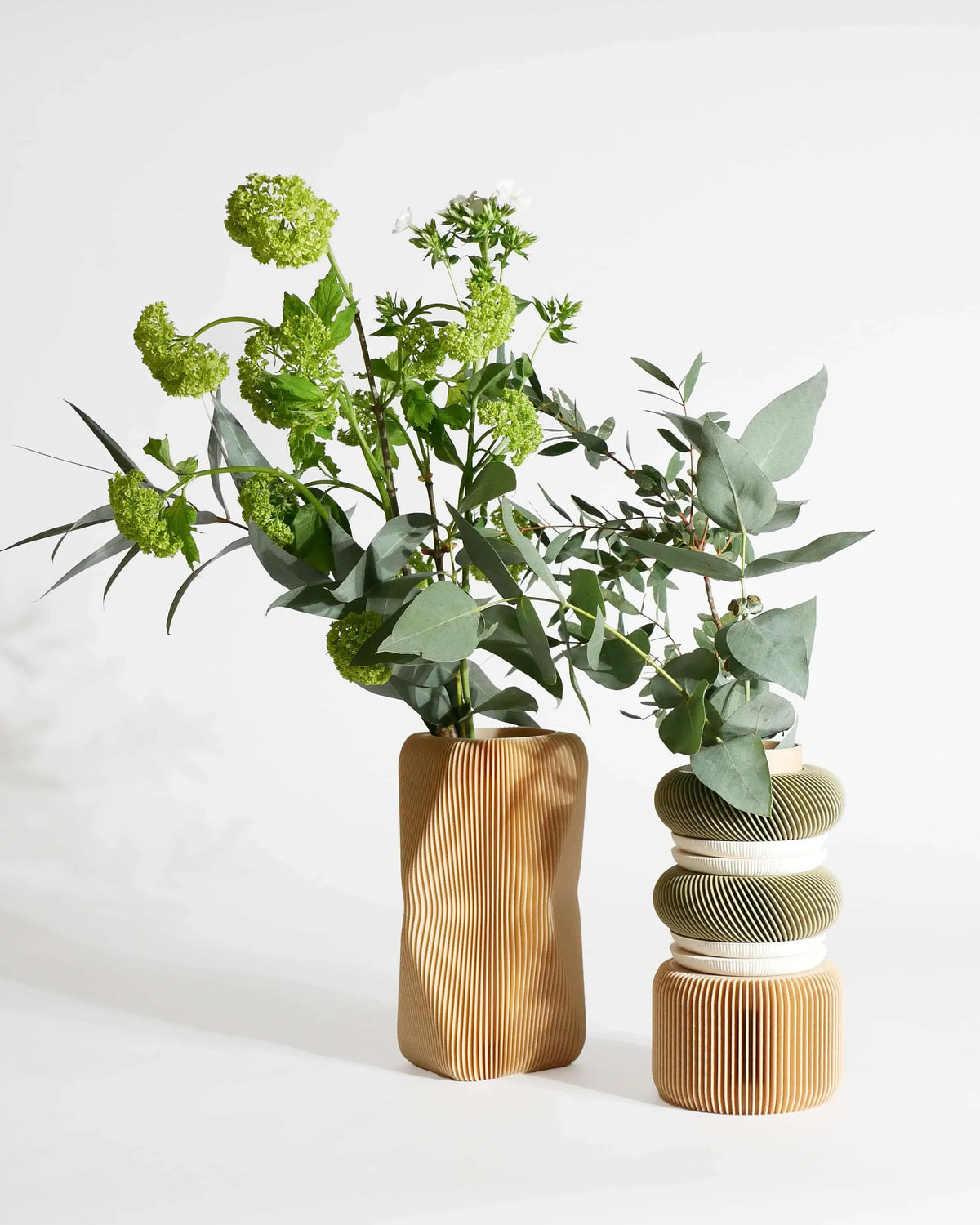 modern soho vase in natural wood with the Nu Modular vase in natural wood and olive wood color