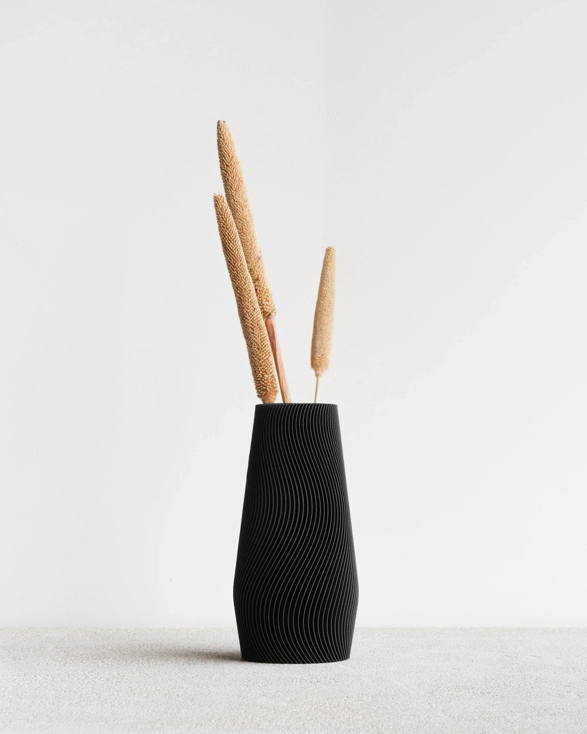 Wave tectured vase in matte color on a white bacground