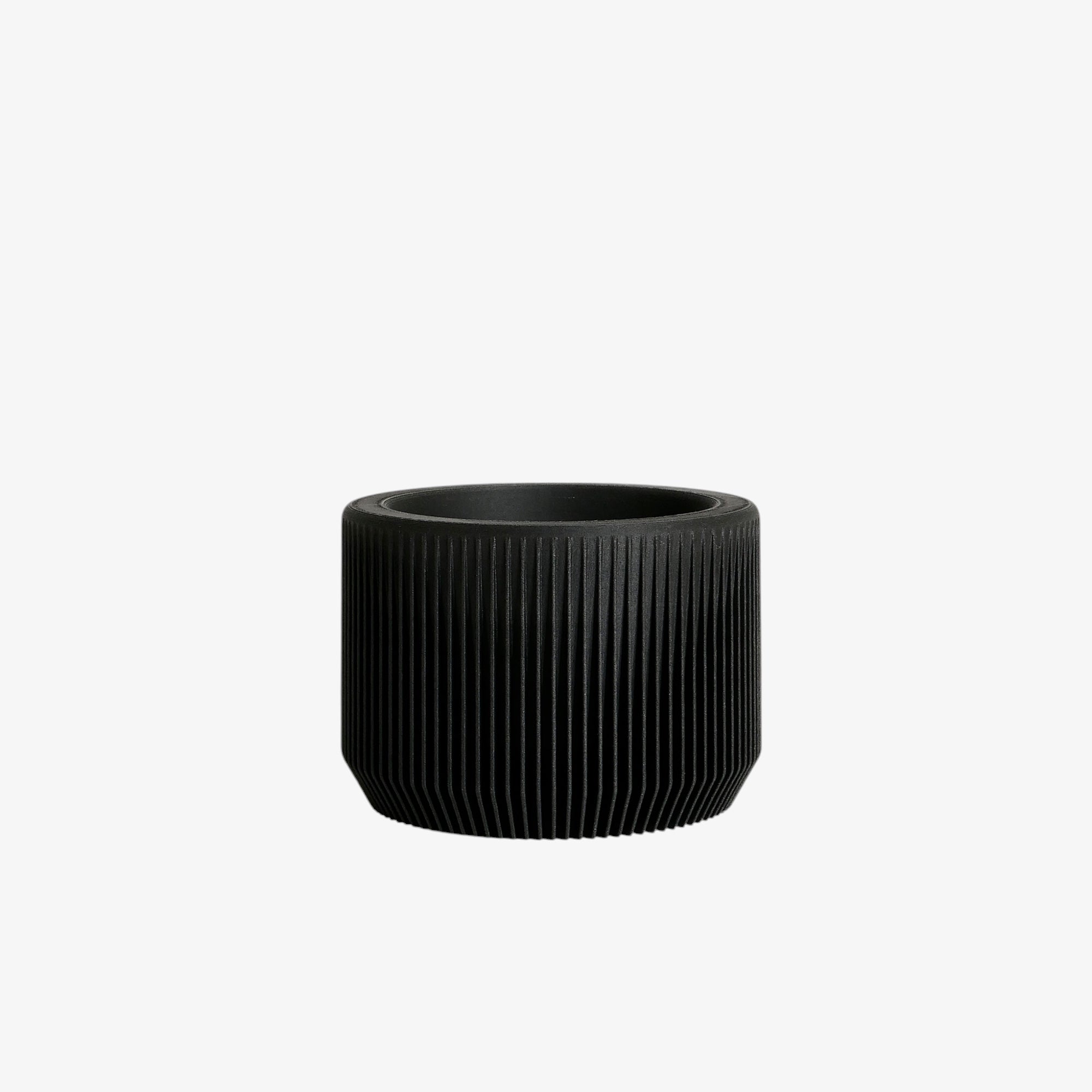 Perfect for a contemporary aesthetic, the black Praha planter introduces depth and contrast, giving your plants the attention they deserve #color_Black