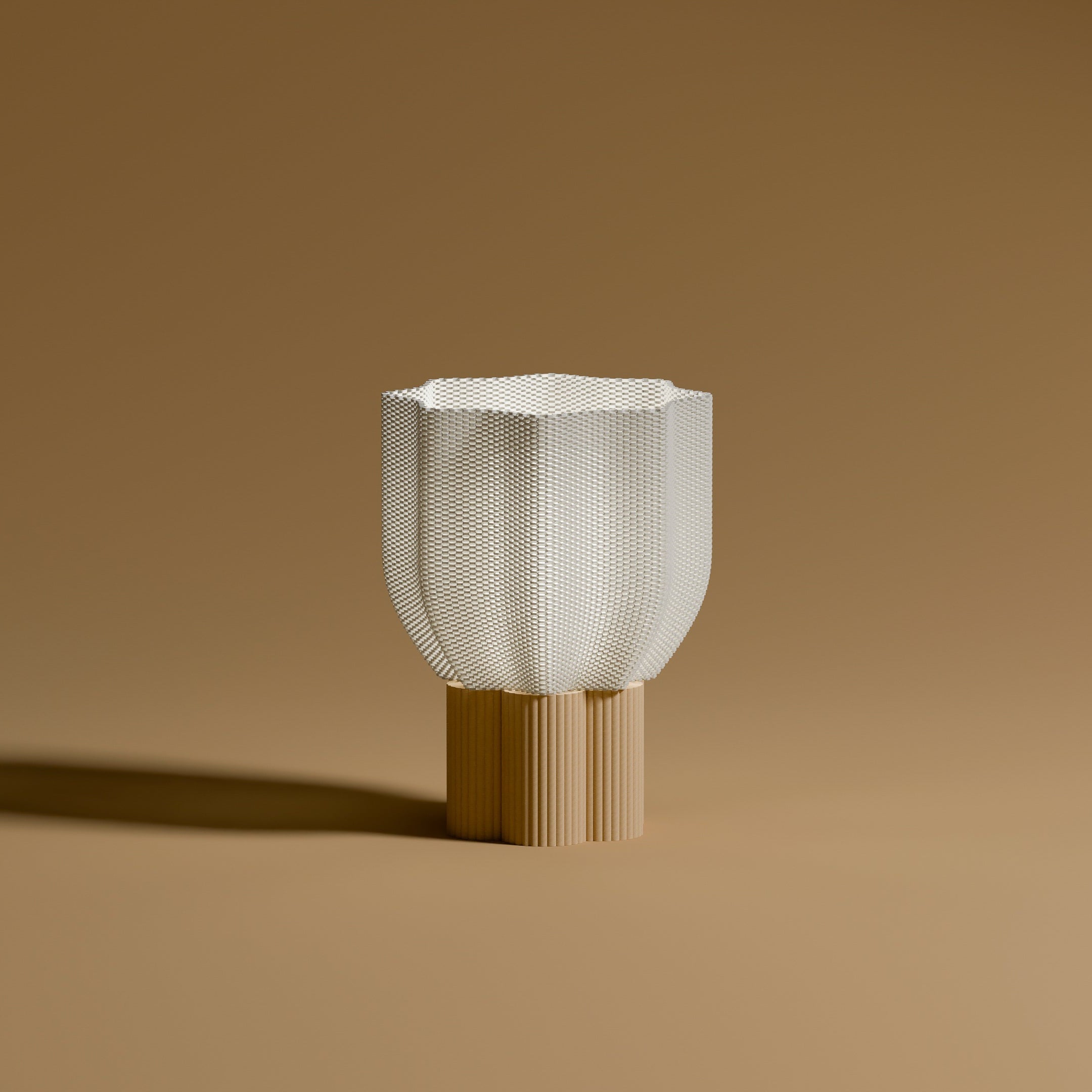Bloom lamp lit, with a natural wood base, shown on a beige background. The warm light highlights the delicate texture of the shade. A perfect ambient light for bedrooms, reading nooks or welcoming entryways.