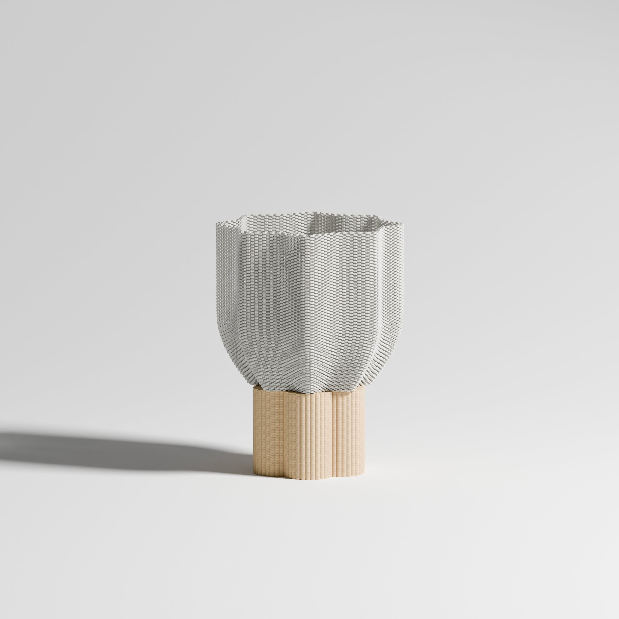 The Bloom lamp with a natural wood base, shown against a white background. Its 3D-printed shade, inspired by a blooming flower, combines pure lines and responsible design. Handmade in France.