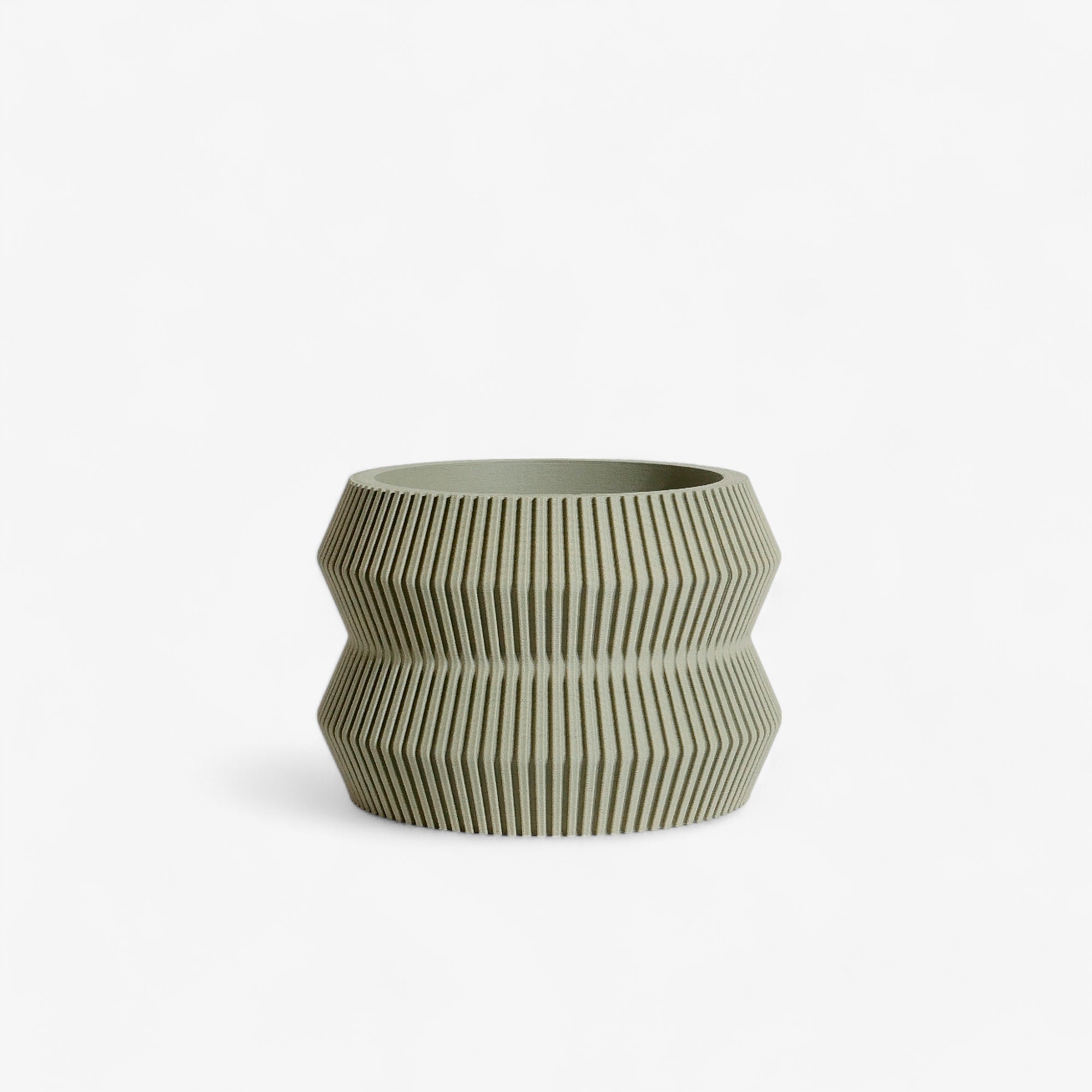 Olive ITO planter, featuring a unique blend of minimalist lines and an organic texture, ideal for modern interiors and adding a subtle pop of color #color_olive