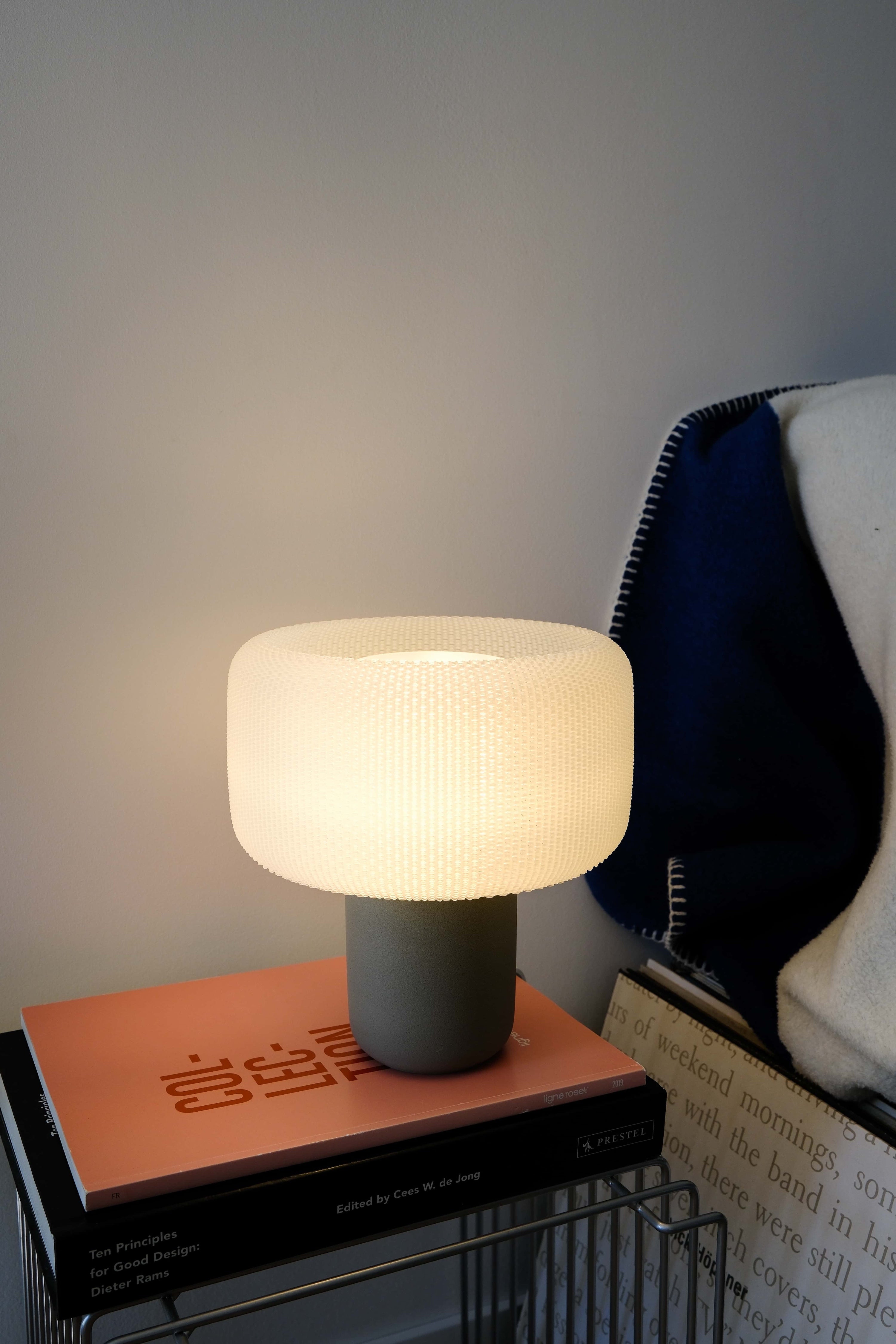 Table lamp on a stack of books with a cozy atmosphere #color_Olive
