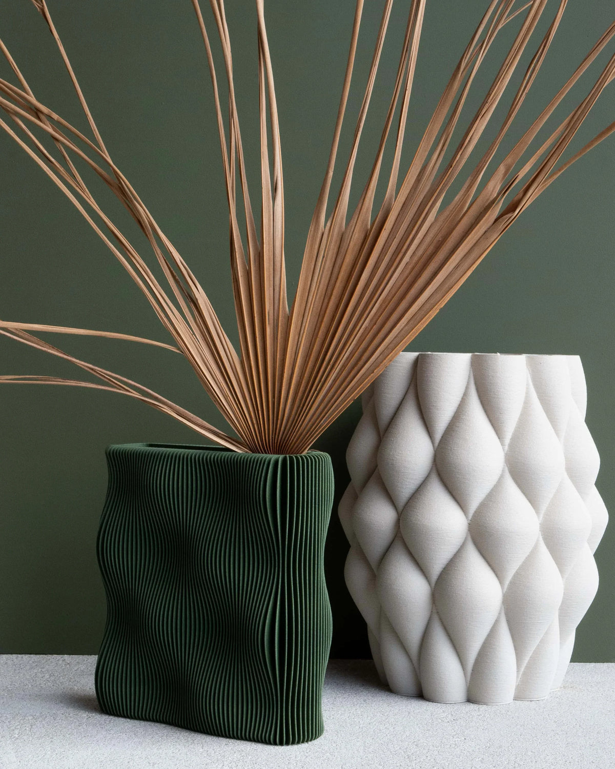 TIDE vase Green and white sculptural vase duo with dried palm stems, green background, designer home decor
