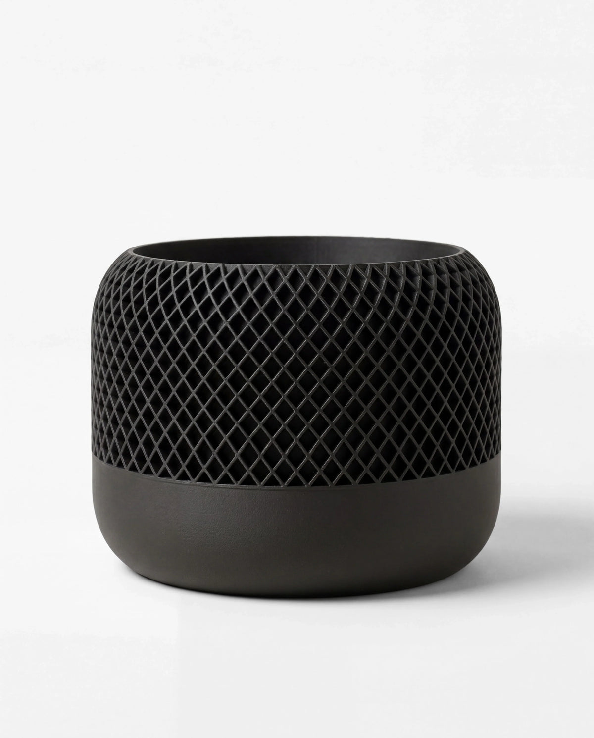 Black textured planter on a white background