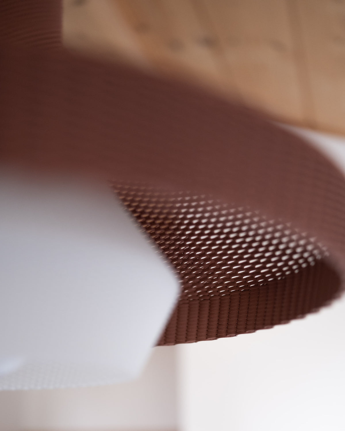 Minimum Design WOVE pendant light, close-up of terracotta ribbed woven texture, plant-based resin