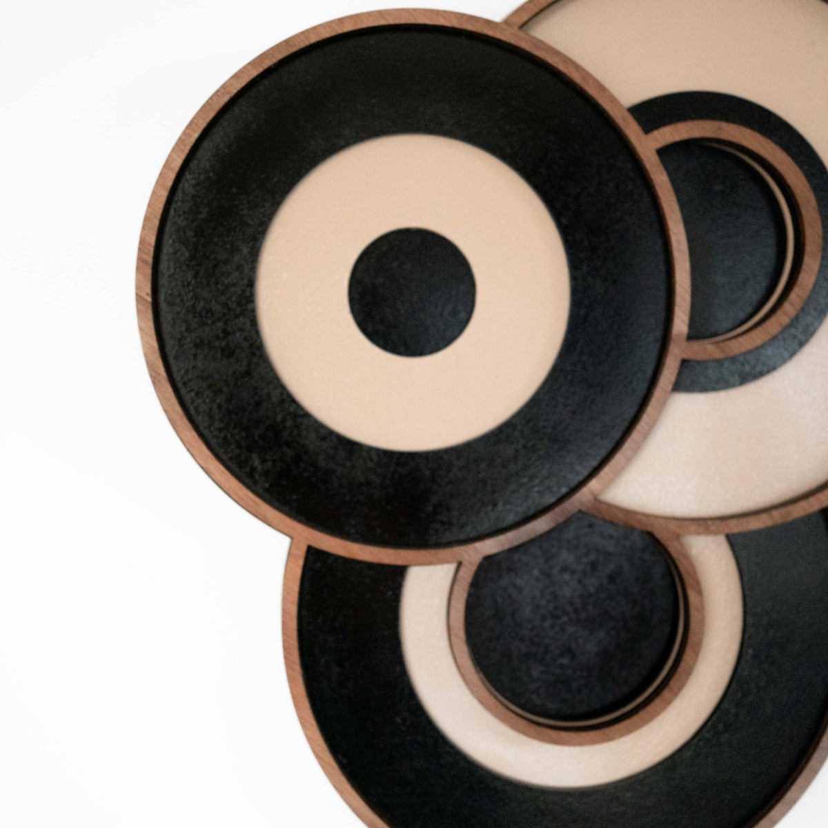 Detail of layered circular shapes on PRISM geometric wood wall art