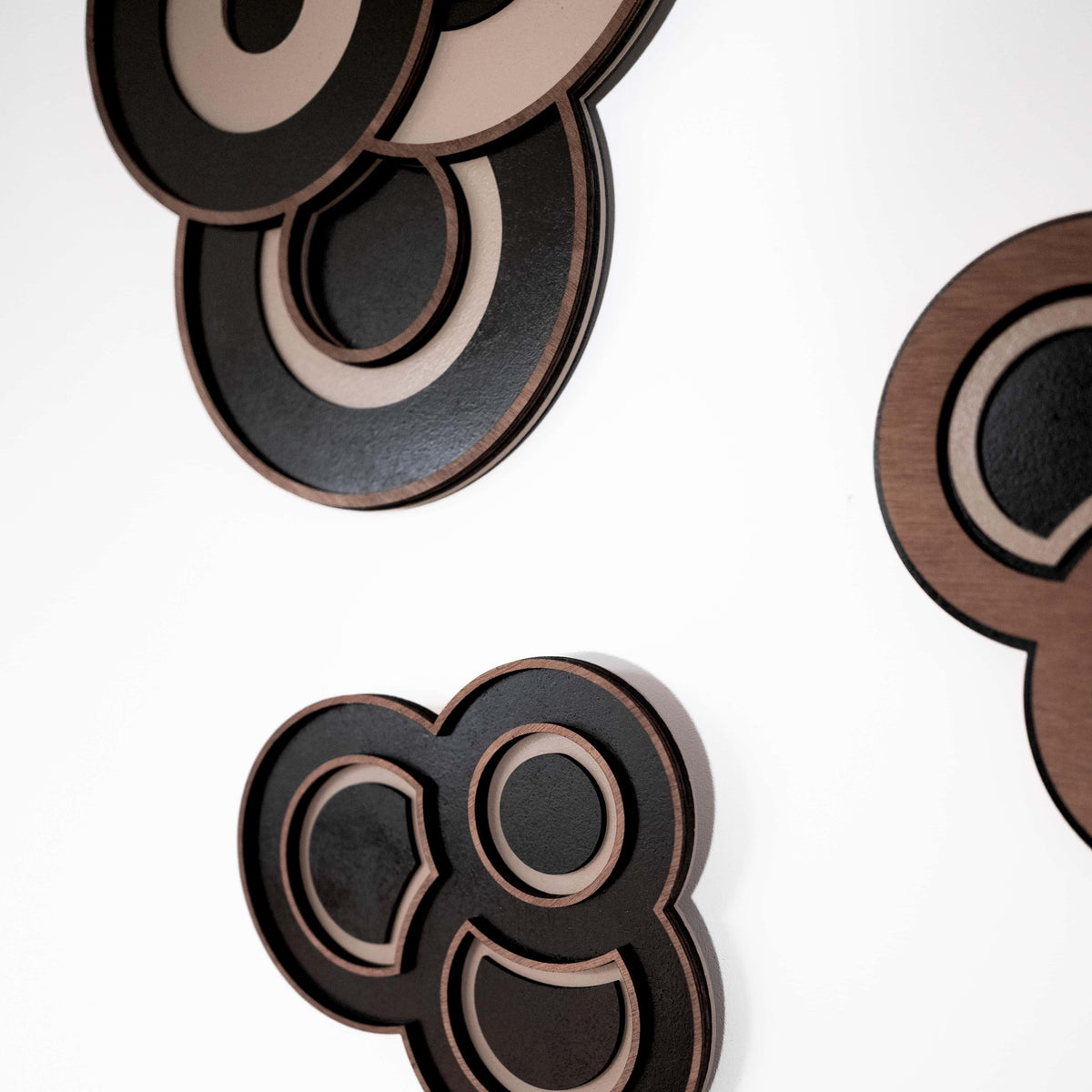 Decorative wall art with circular designs on a white background