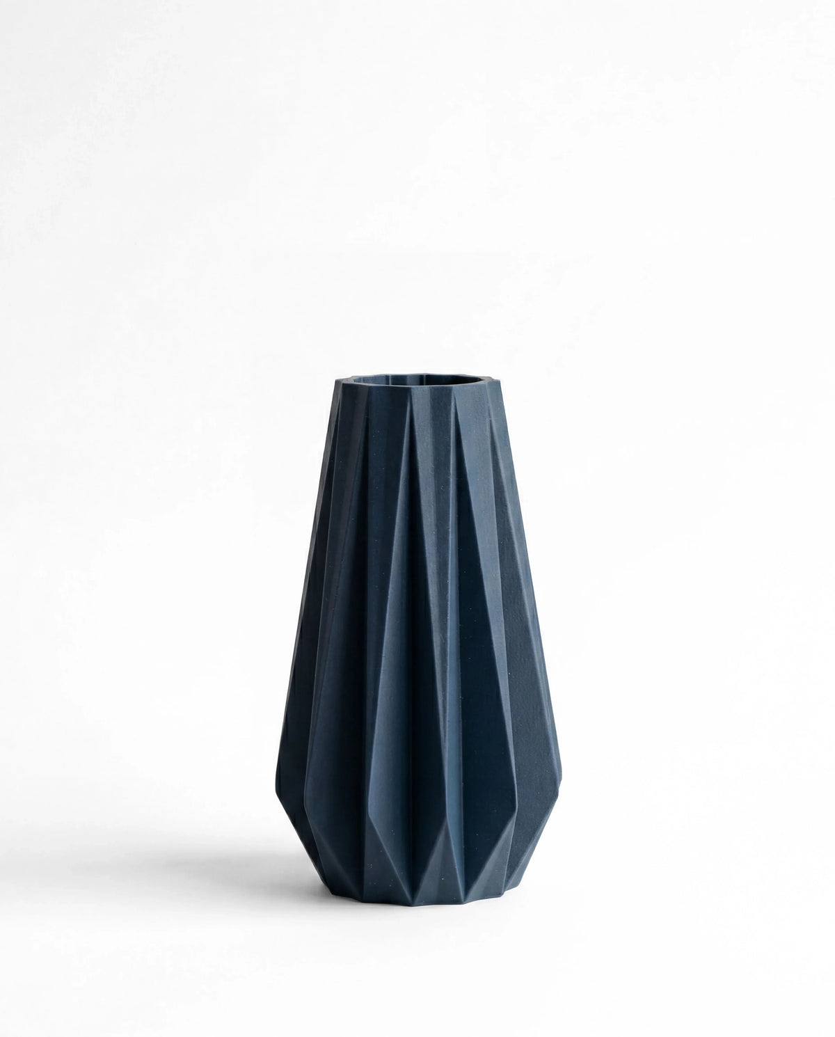 Origami vase blue 20cm - geometric pleated design on white background