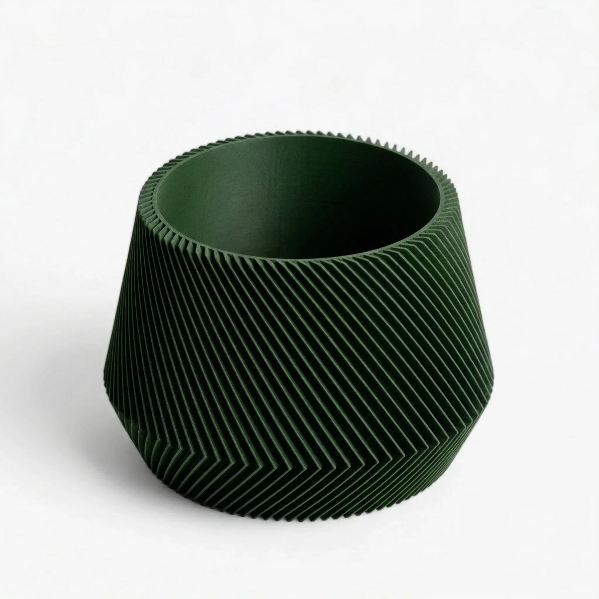 Green textured vase on a white background