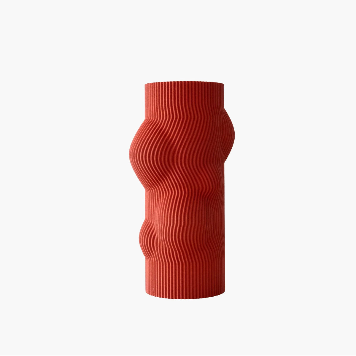 Red ribbed vase on a white background