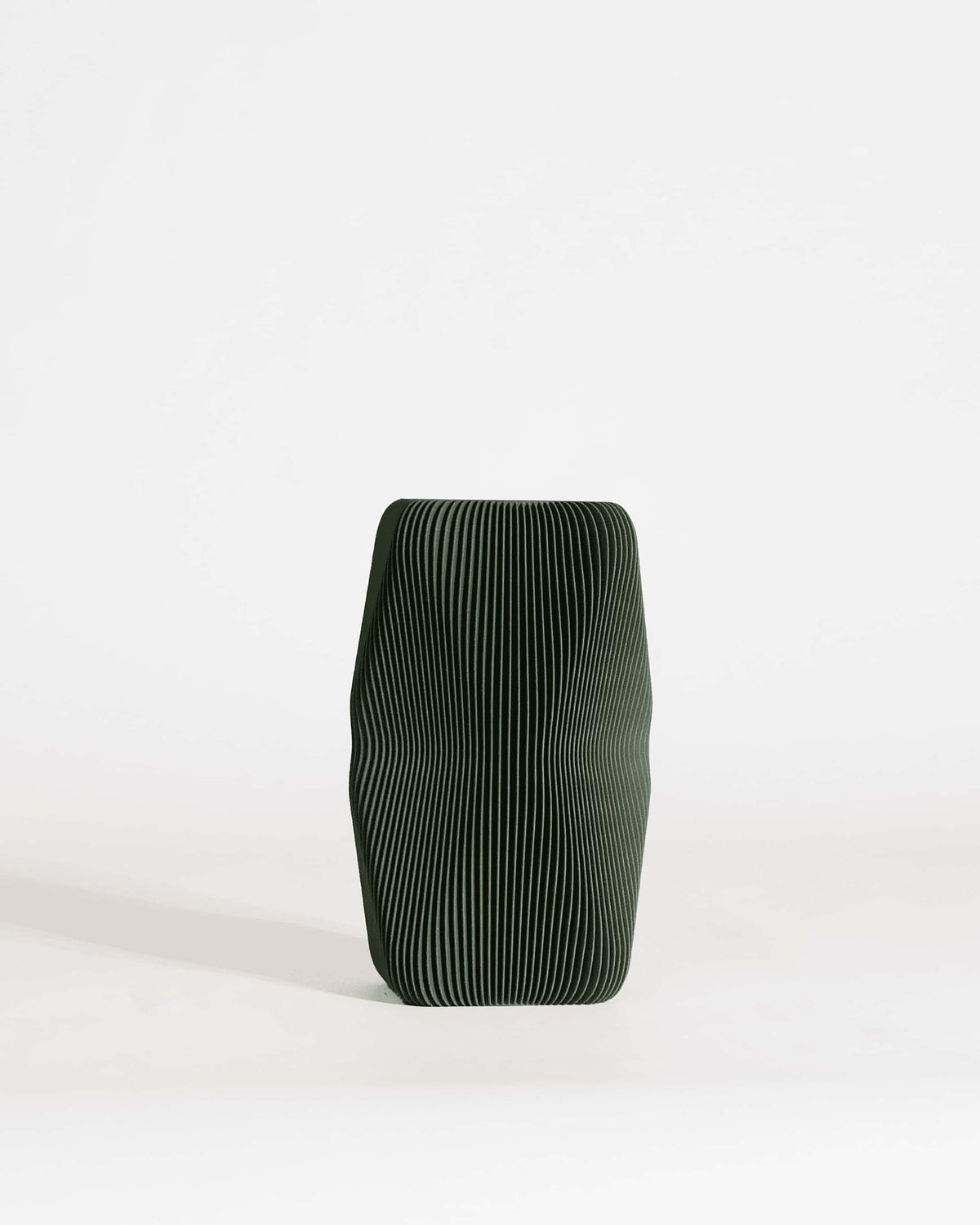 Soho sculptural vase forest green 20cm, wave texture organic design on white background