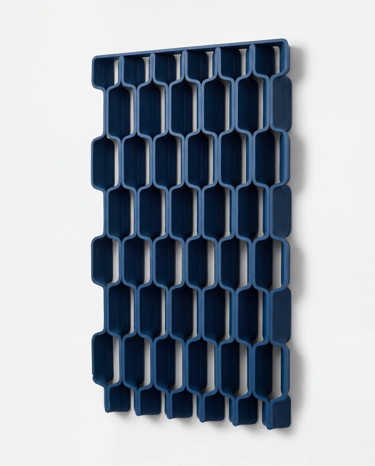 TRAM large format geometric lattice wall panel - three quarter view, interlaced pattern, navy blue - Minimum Design
