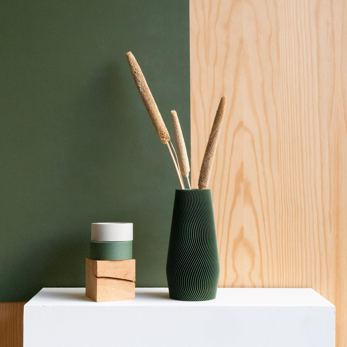 Wave vase forest green with dried stems - minimalist nordic shelf styling