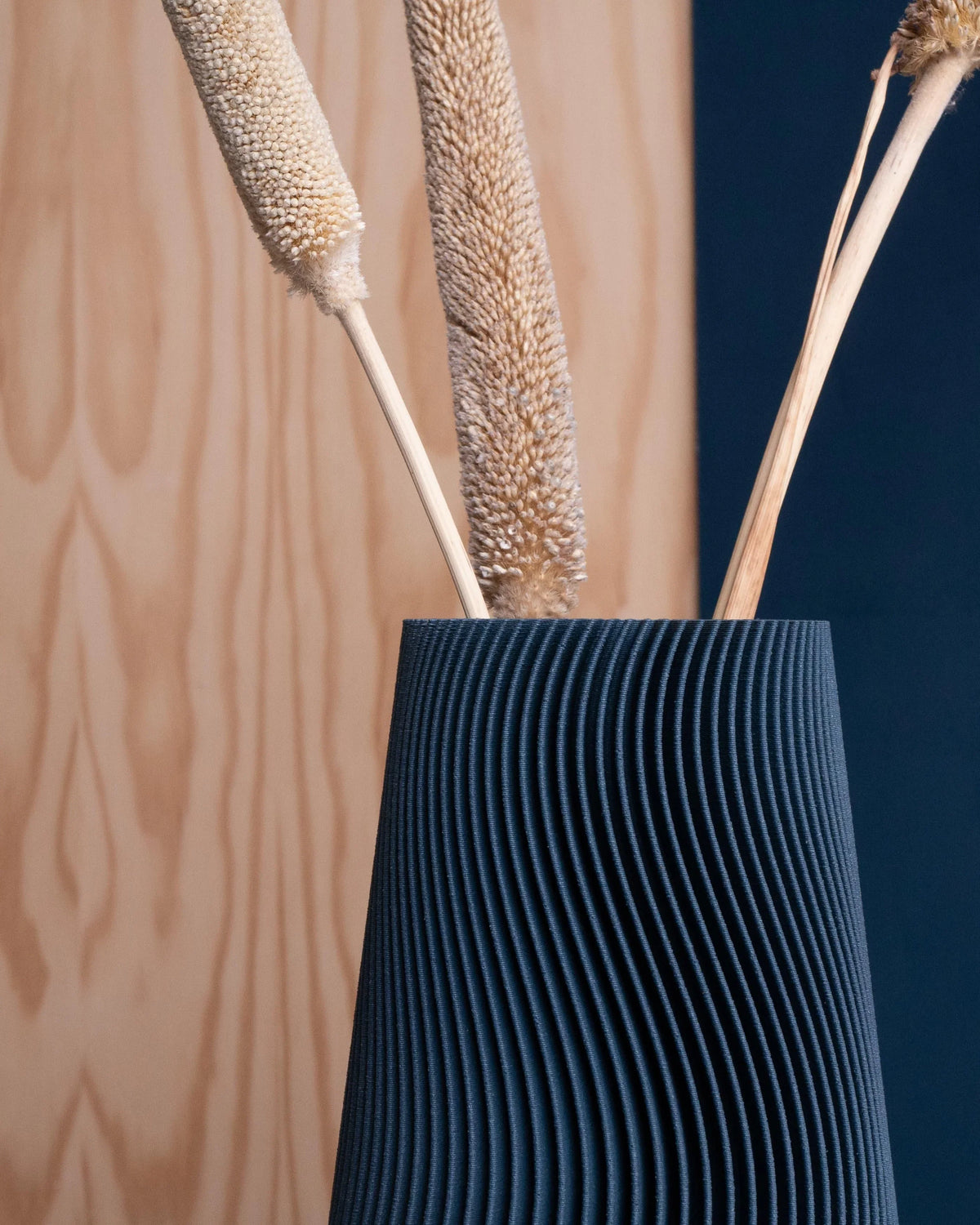 Petrol blue wave vase close-up texture detail - handcrafted organic design